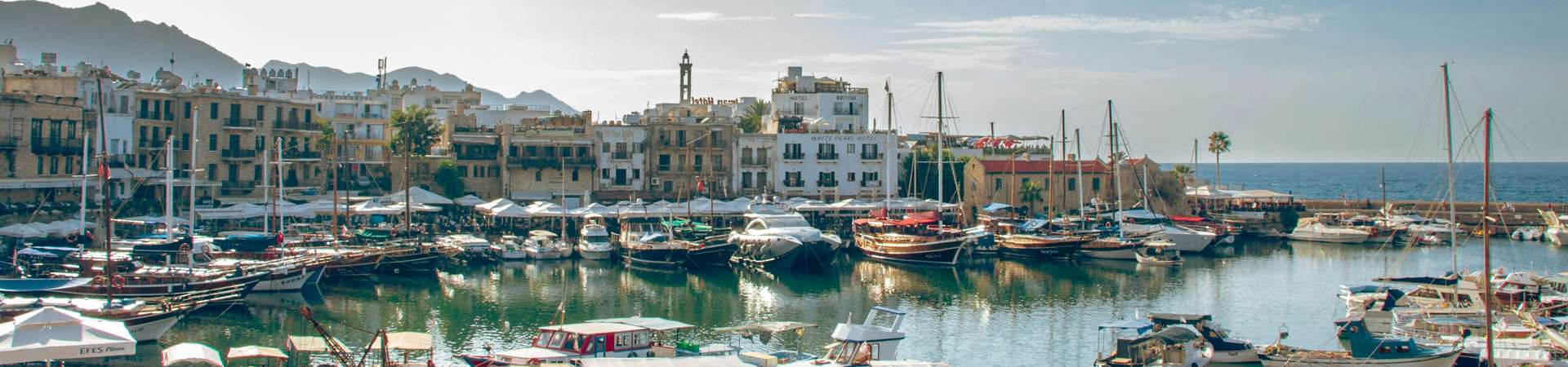 Coastal town with palm trees representing gaming licensing in Cyprus